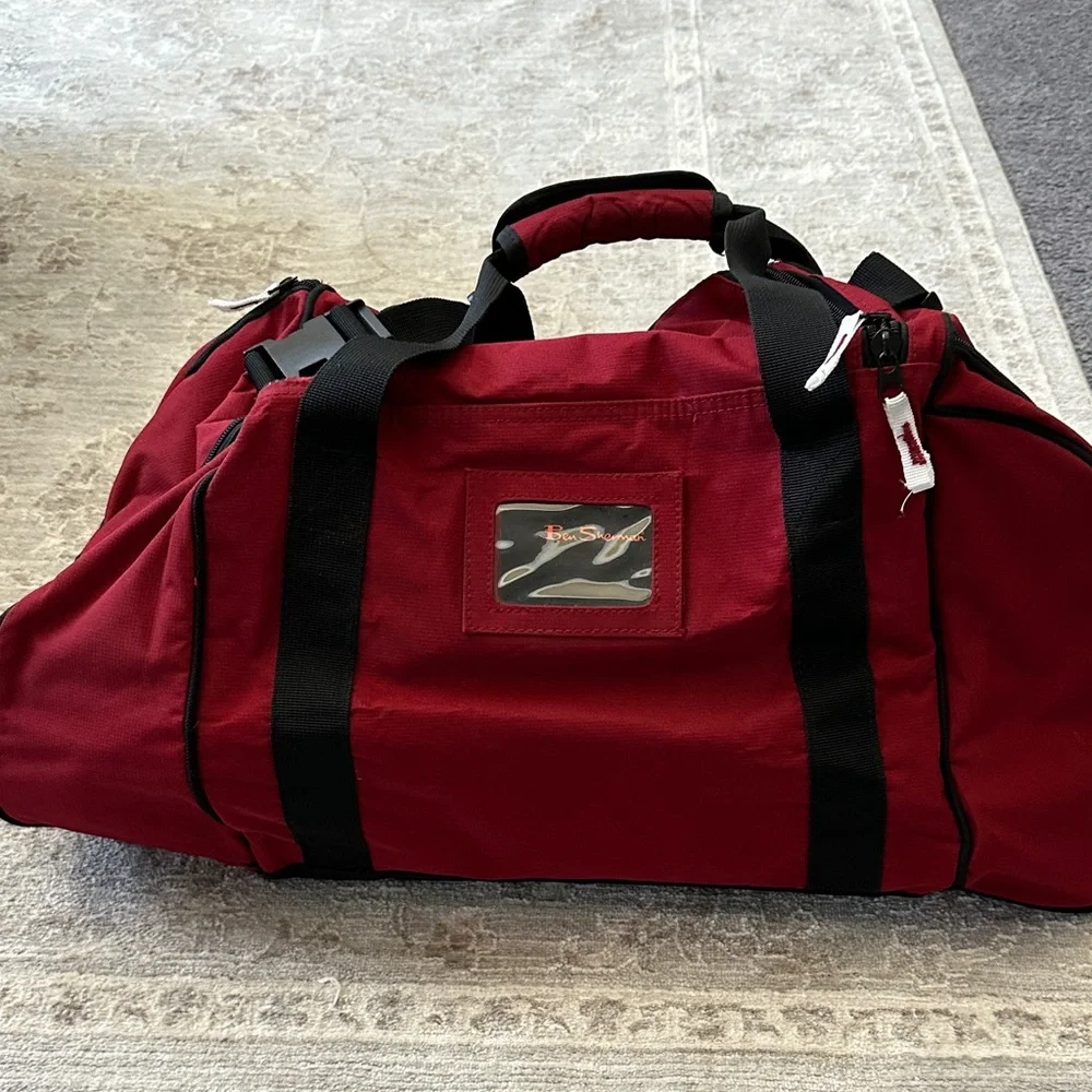 Ben Sherman Burgundy Duffel Bag with Black Accents.